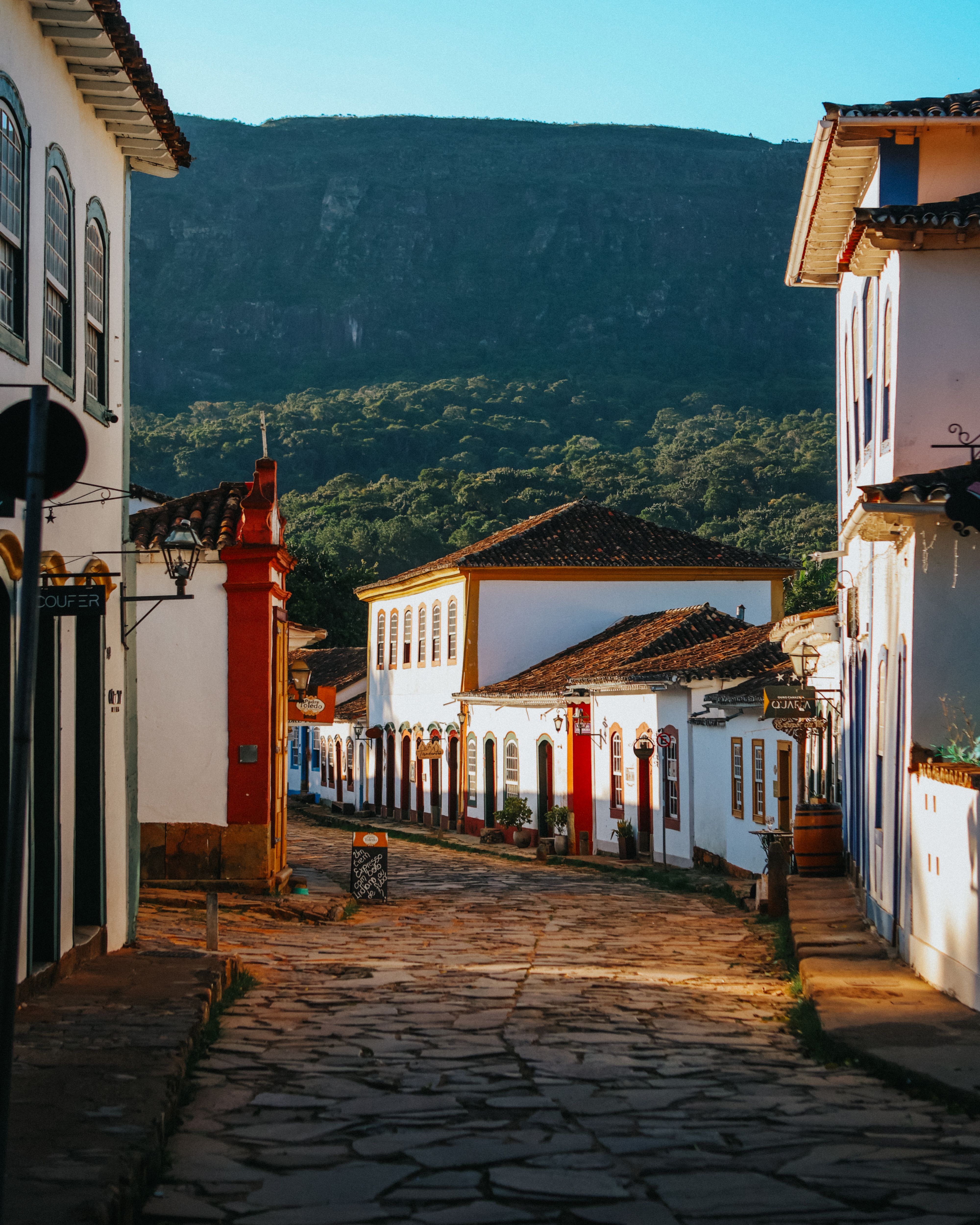 Cobblestone street with mountain backdrop in Pirenópolis